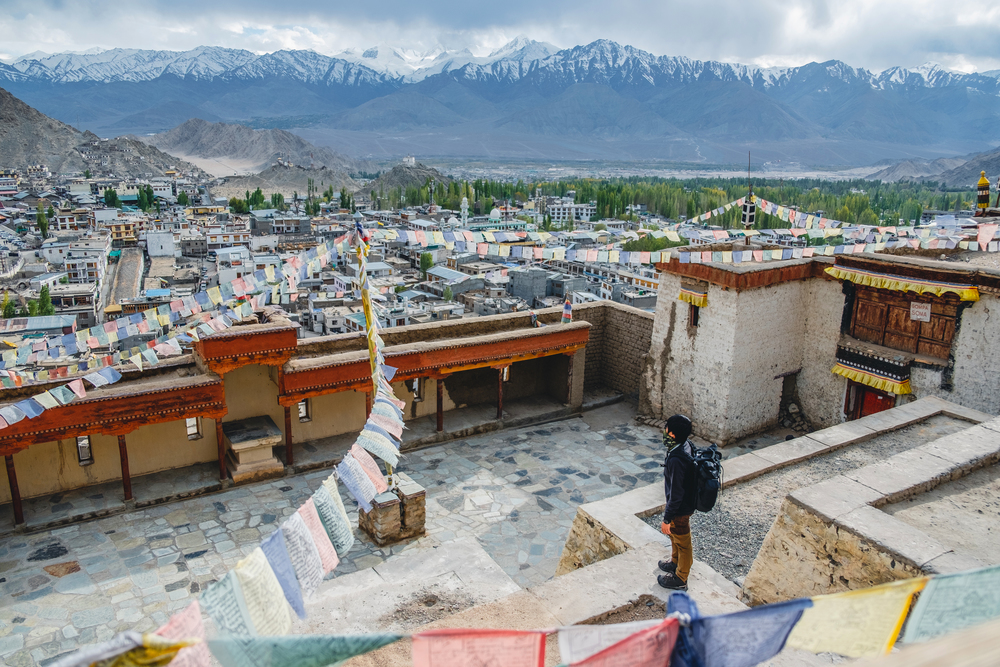 Traveler Man standing and looking view of landscape in Leh Palace ,Norther part of India