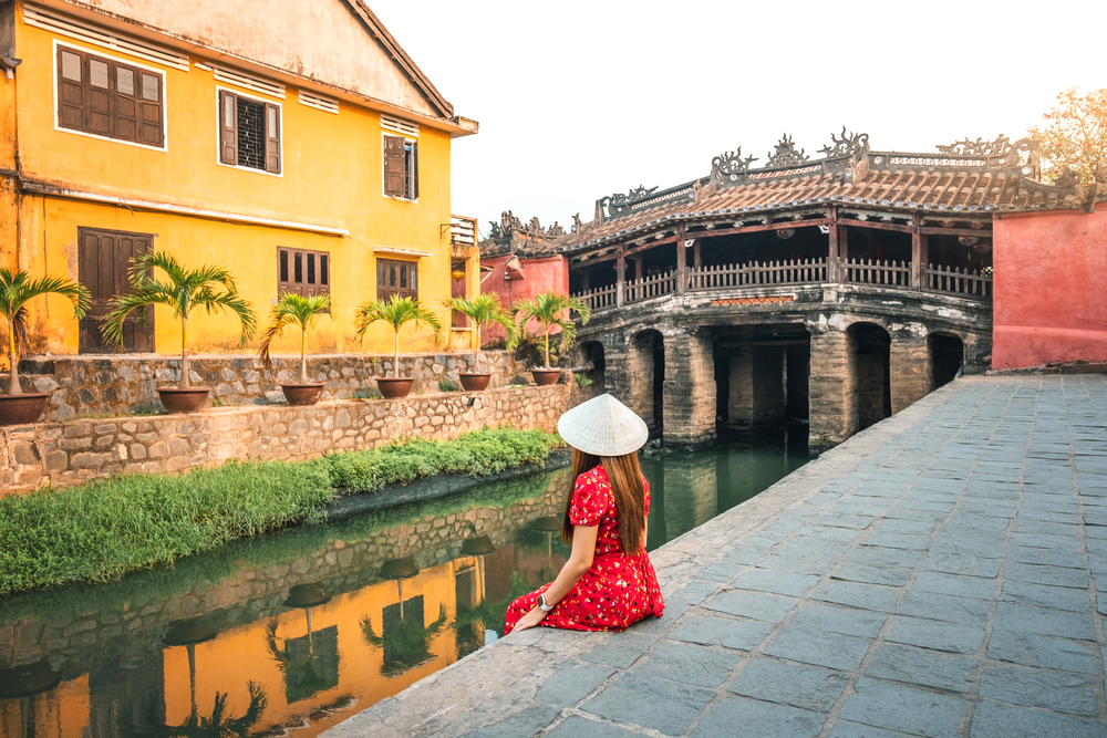Travel woman with Japanese Covered Bridge,  in Hoi An, Vietnam