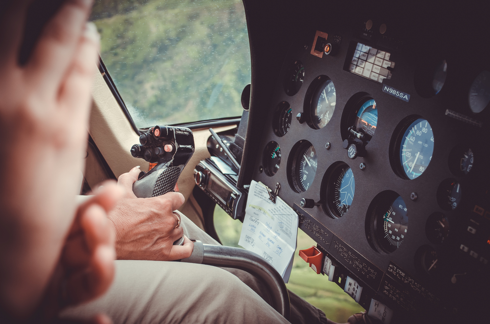 Kauai is Hawaii&rsquo;s fourth largest island and is sometimes called the Garden Island, which is an entirely accurate description. Pilot hand driving a helicopter above Kauai, US