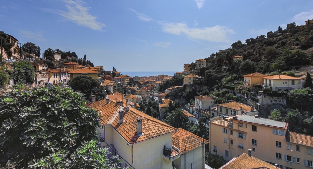 View on Menton city houses and roofs and mediterranean sea, France