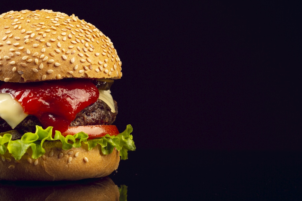 Close-up burger with black background