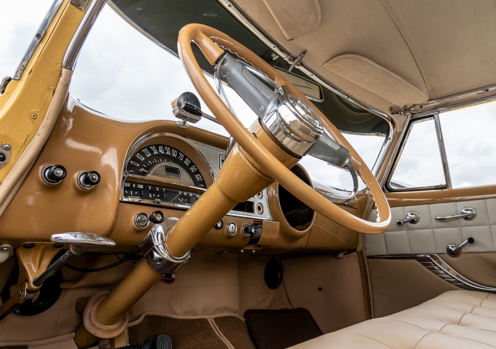 A low angle shot of the interior of a car including the steering wheel. Low angle shot of the interior of a car including the steering wheel