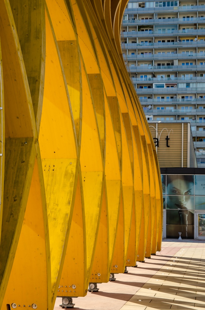 Donau City, Vienna, / Austria - 01, August 2013: View at Modern yellow wooden sculpture Austria Center in Donau City. Closeup view architecture. Modern yellow wooden sculpture Austria Center