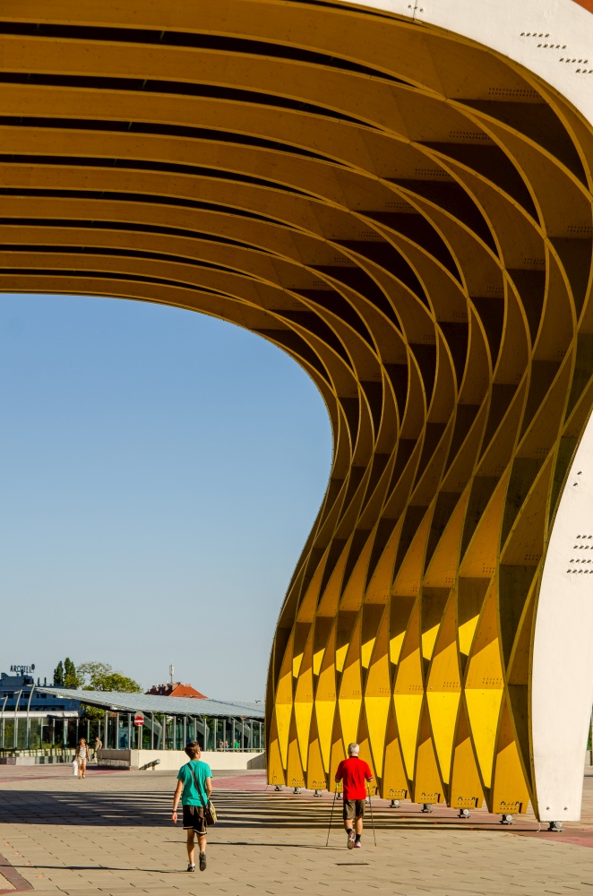 Donau City, Vienna, / Austria - 01, August 2013: View at Modern yellow wooden sculpture Austria Center in Donau City. Closeup view architecture. View at Modern yellow wooden sculpture Austria Center