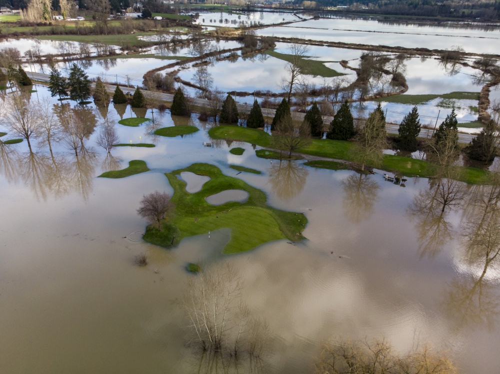Aerial of mass flooding on golf course after rain storm