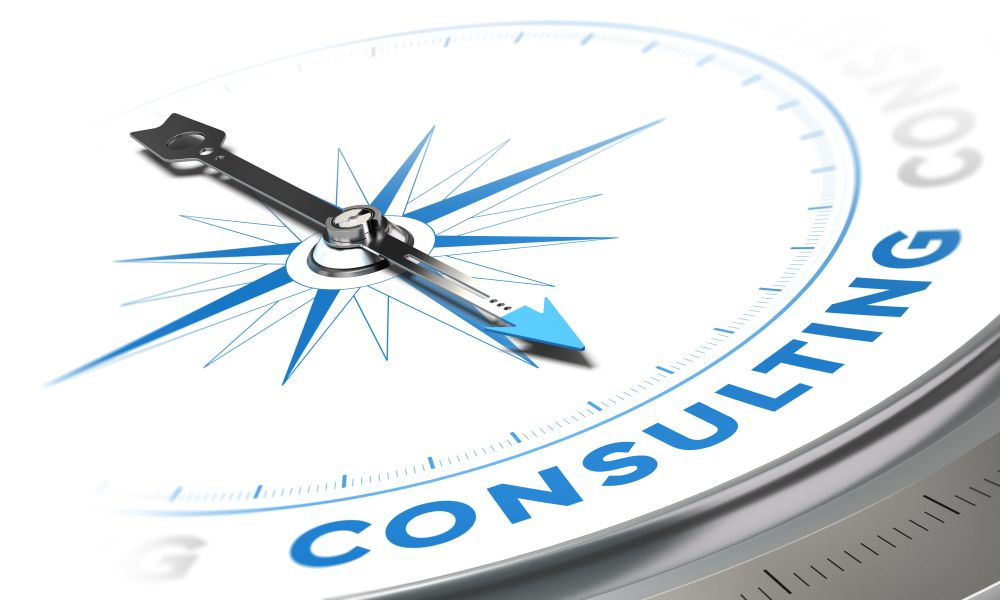 Business consulting concept image, Compass with needle pointing the word consulting, blue tones over white background. Consulting