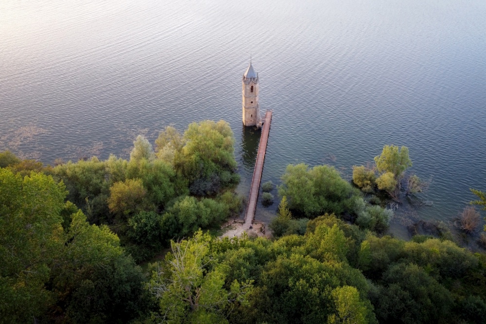 Aerial view of The fish cathedral. Sunken church ruins located in the Ebro reservoir in Cantabria, in the north of Spain. High quality photo. Aerial view of The fish cathedral. Sunken church ruins located in the Ebro reservoir in Cantabria, in the north of Spain.