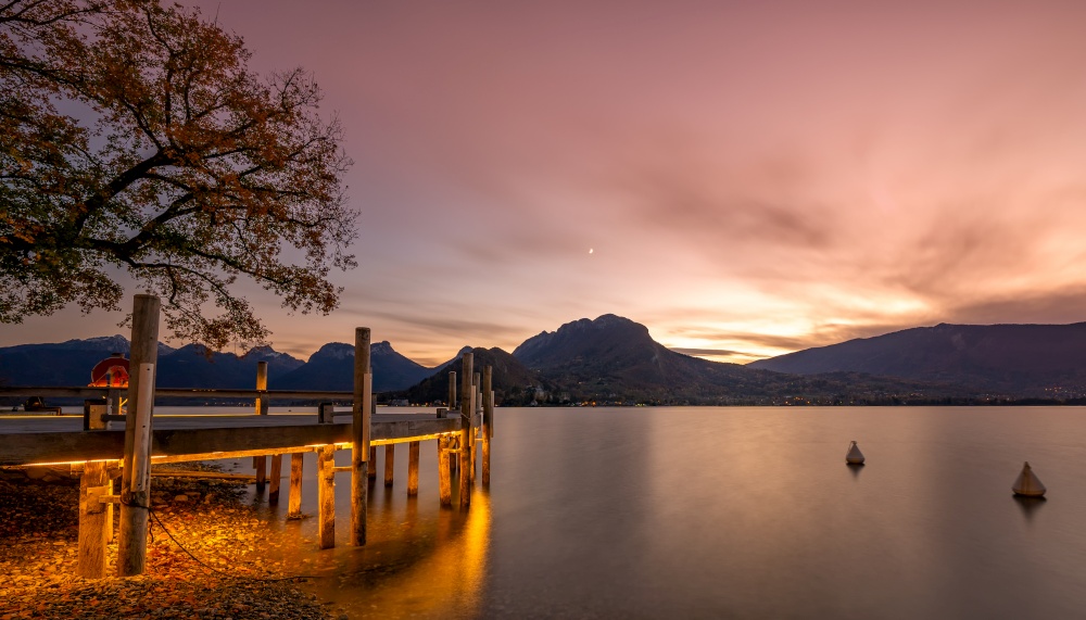 sunset in Annecy. Red clouds and a lake in the French Alps