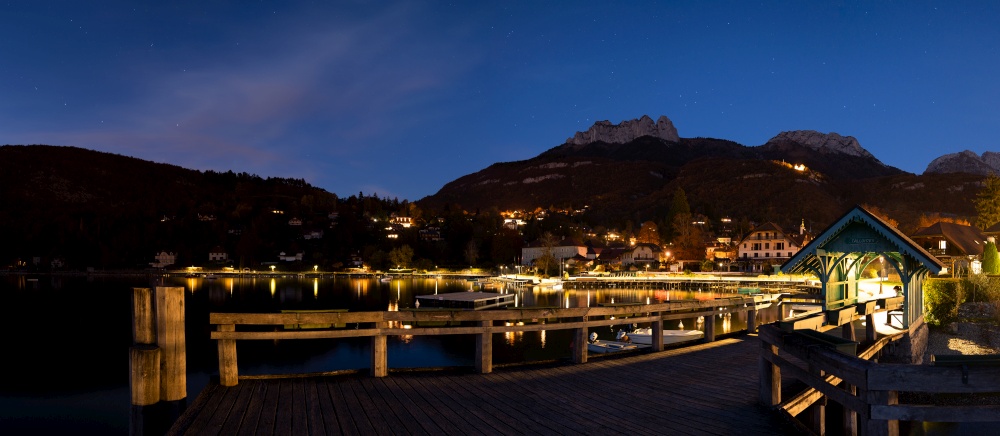 Dusk in the lake of Annecy. Lake near a pier in the middle of the night