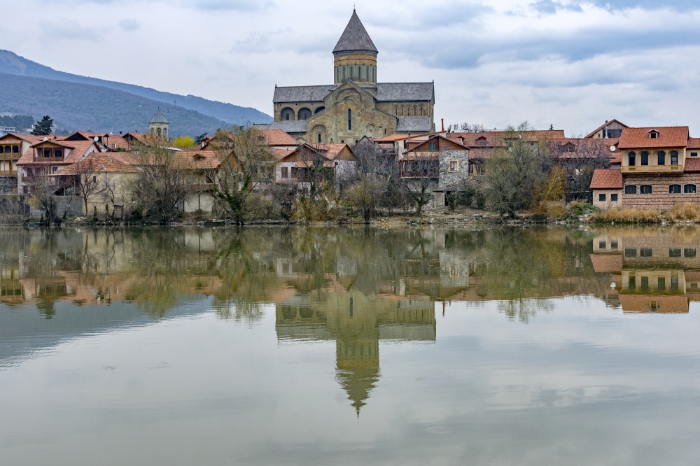 View of Svetitskhoveli cathedral over Mtkvari (Kura) river at early springtime