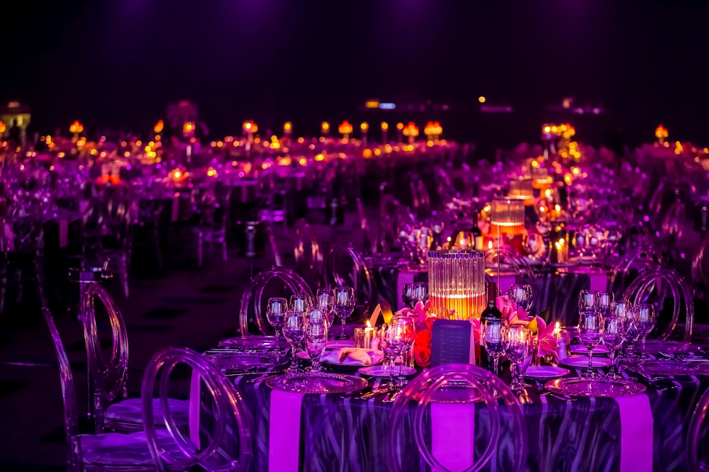 candles and lamps on gala dinner tables with purple colour decor