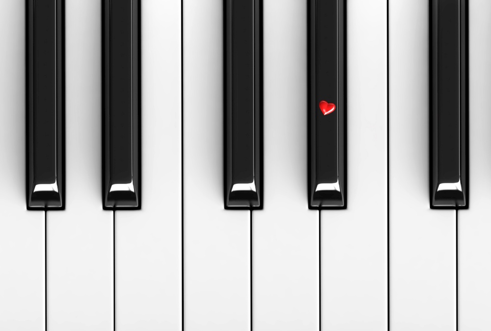 3d render of red heart over piano keys