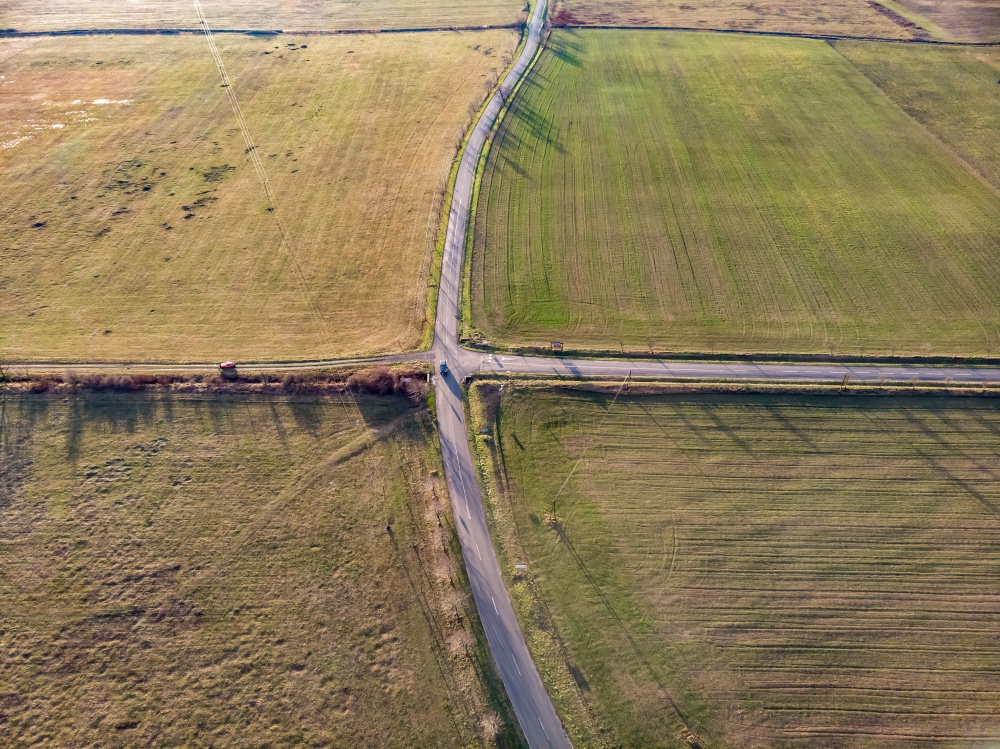 Aerial drone picture over asphalt road