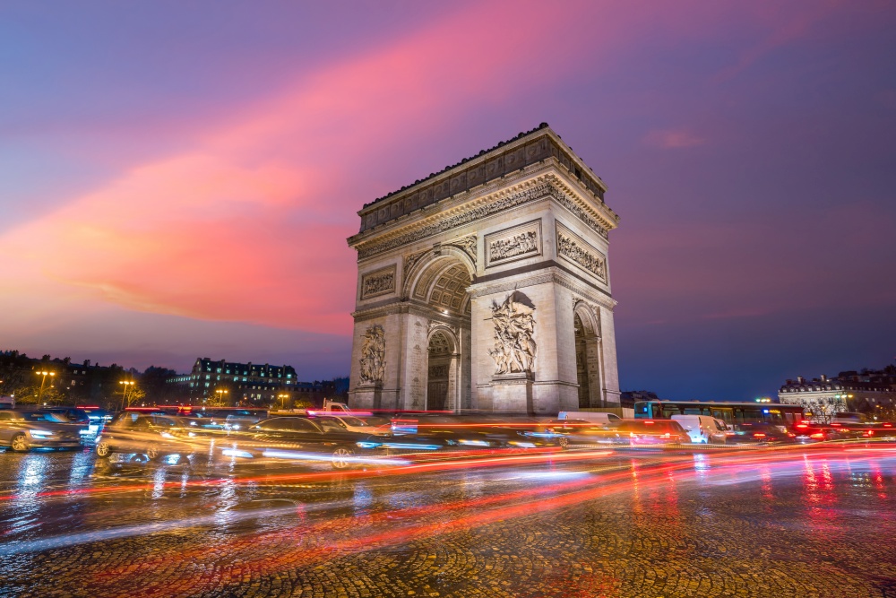 Arc de Triumph in Paris, France at twilight