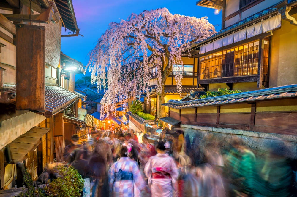 Tourists at old town Kyoto, the Higashiyama District during sakura season in Japan