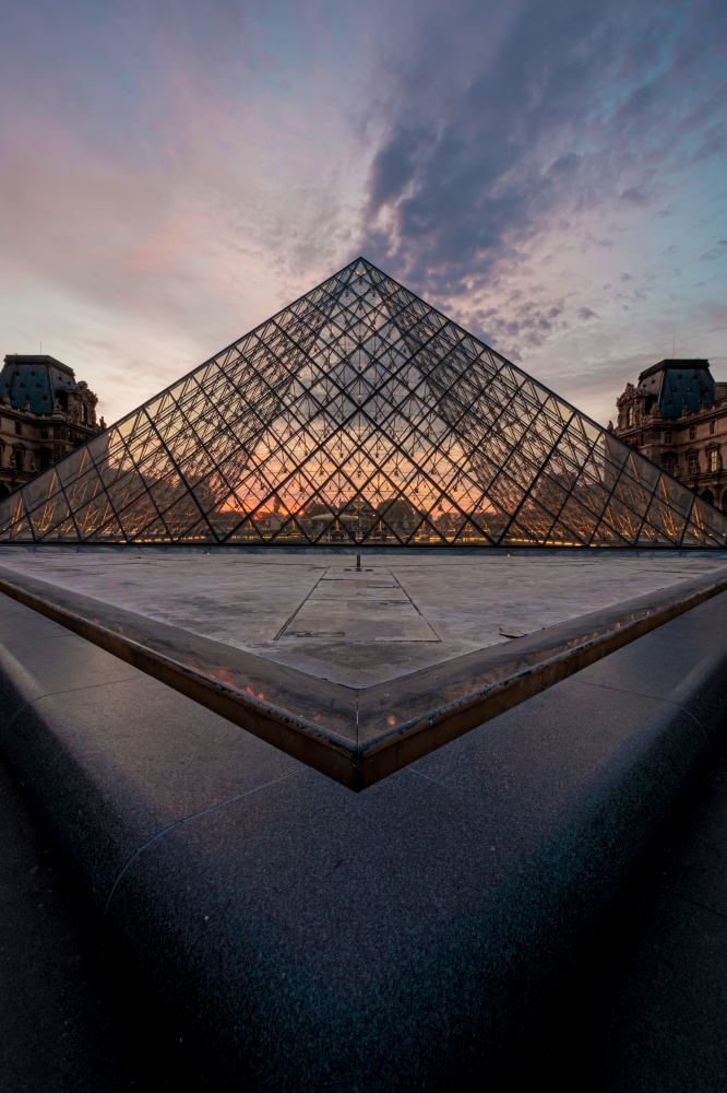 Landscape of the Louvre museum at the sunset, Paris, France
