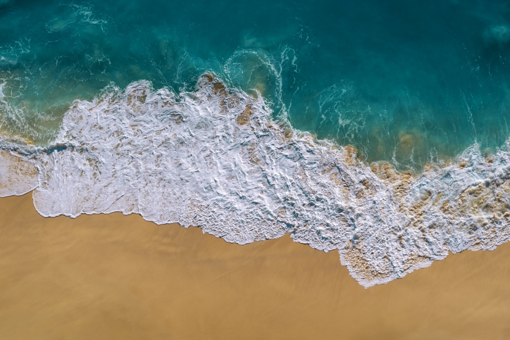 Aerial view of Ocean wave and Kelingking Beach in Nusa Penida island, Bali in Indonesia.