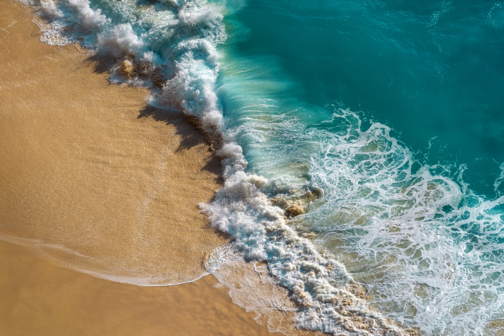 Aerial view of Ocean wave and Kelingking Beach in Nusa Penida island, Bali in Indonesia.