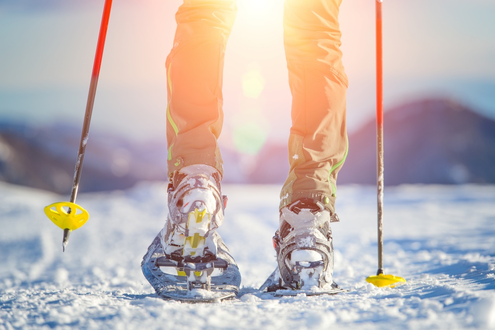 Detail of walking with technical snowshoes in mountains