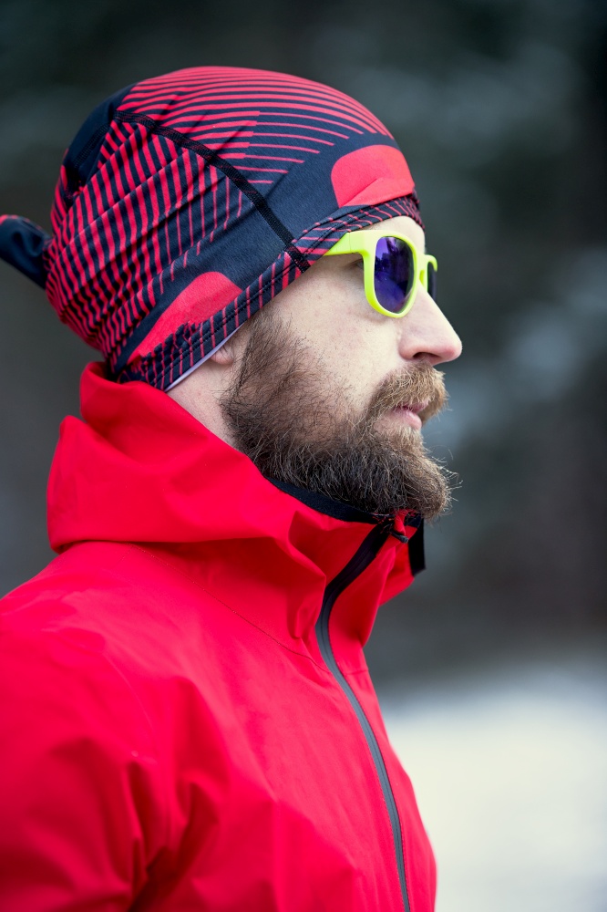 Young man with sporty beard with technical jacket.