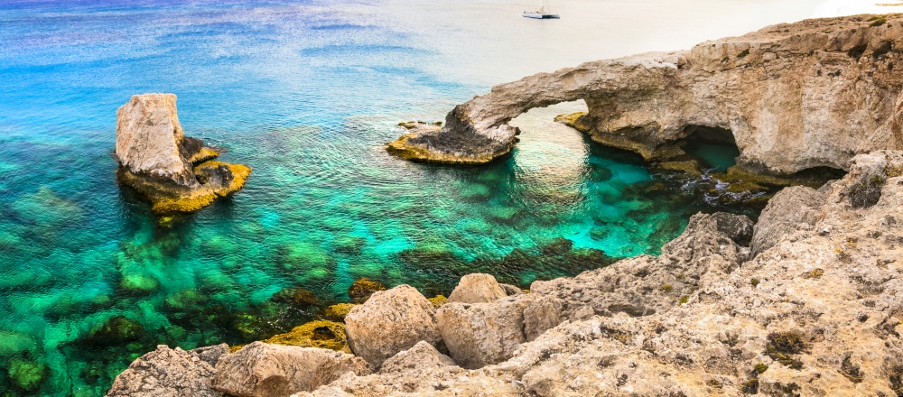 Beautiful nature and  cystal clear waters of Cyprus island. arch bridge near Agia napa calls "bridge of lovers". Cyprus island. natural landmark Bridge of lovers