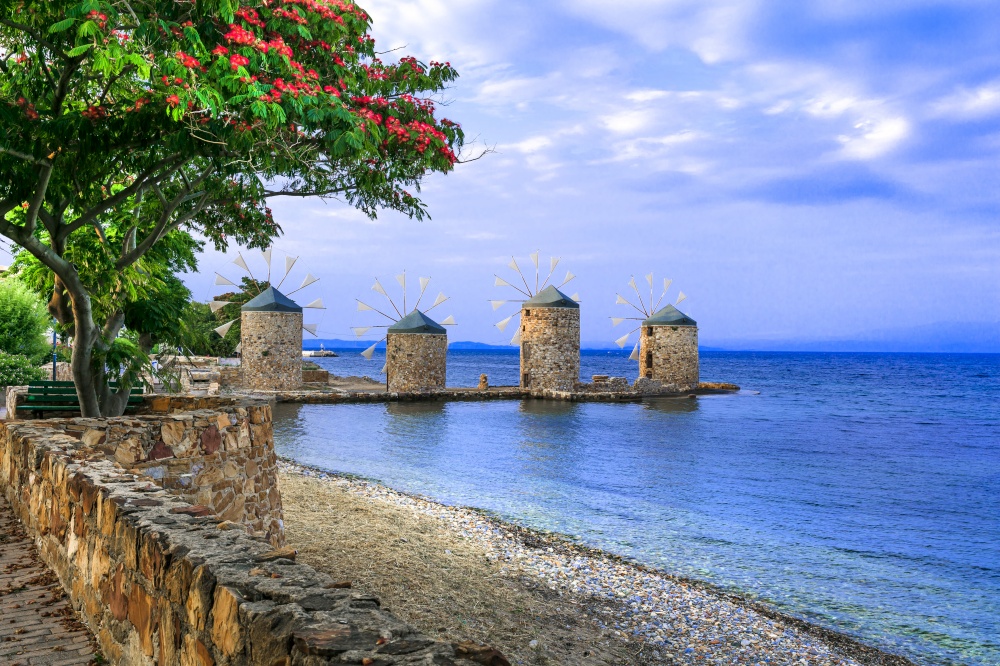 Authentic traditional Greece scenery - old windmills near the sea - landmark of Chios island. Old windmills of Chios island. Greece, Eastern Aegean islands