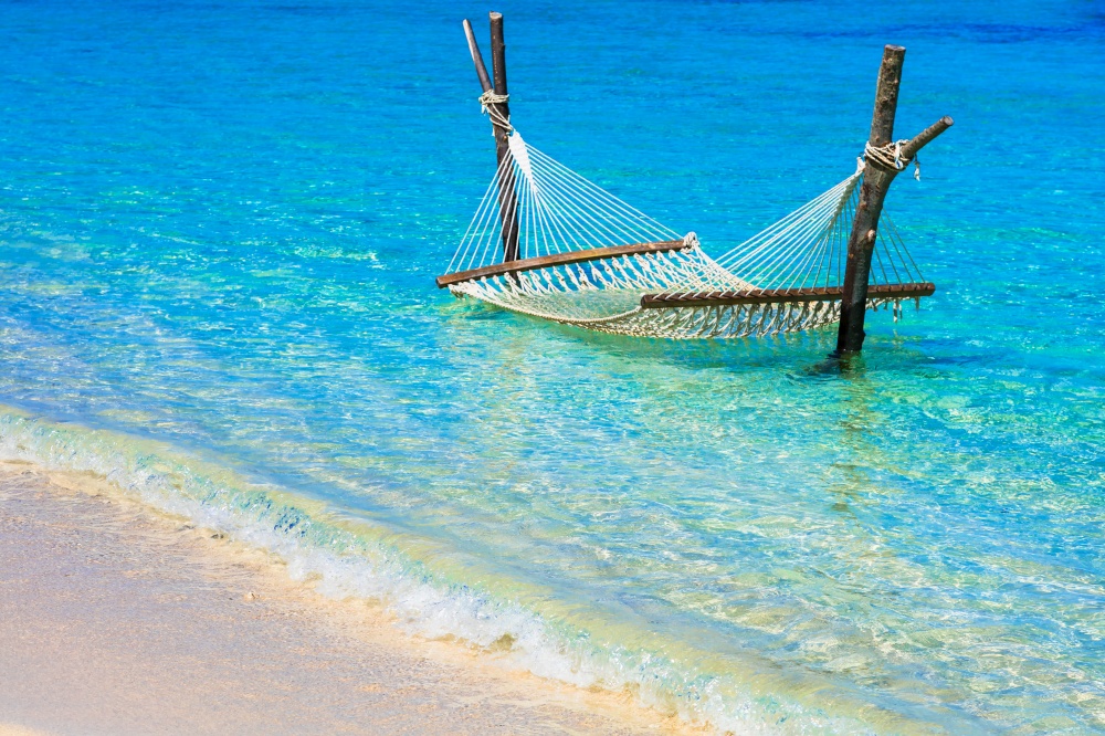 relaxing tropical holidays - hammock in turquoise water