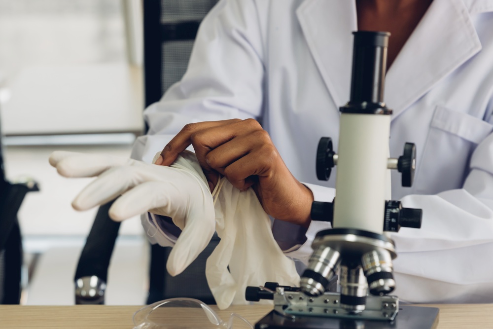 Female Scientist Wearing Gloves At Laboratory