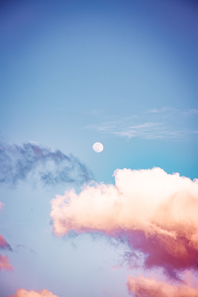 A colorful cloud with a moon over it like in a dream of a movie