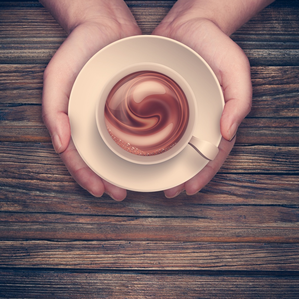 hands holding hot cup of coffee on wooden surface