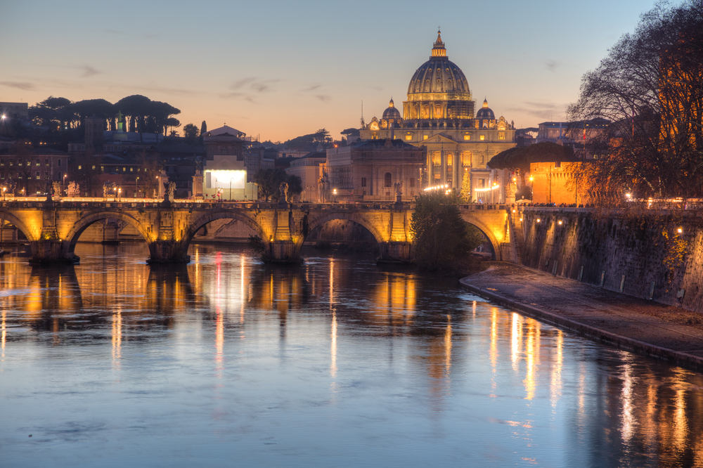 Rome overview with the Papal Basilica of St. Peter in the Vatican city at night