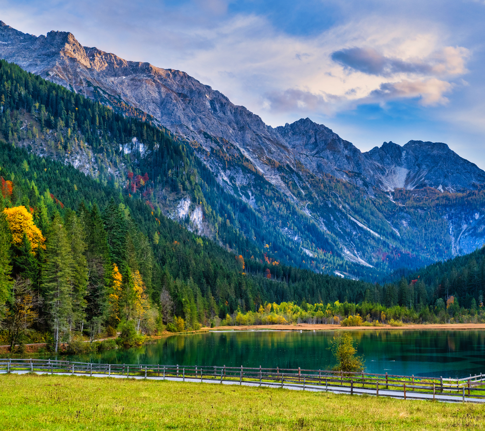 Autumn evening alpine Jaegersee lake and mountains above, Kleinarl, Land Salzburg, Austria. Picturesque hiking, seasonal, and nature beauty concept scene.