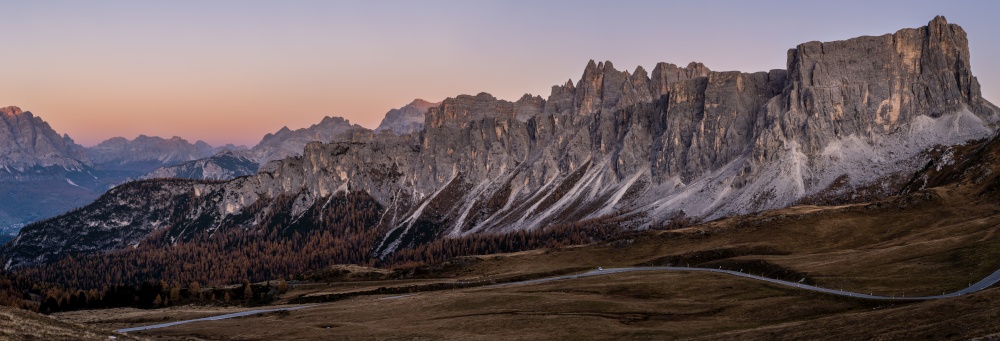 Italian Dolomites mountain peaceful evening dusk panorama from Giau Pass. Picturesque climate, environment and travel concept scene.