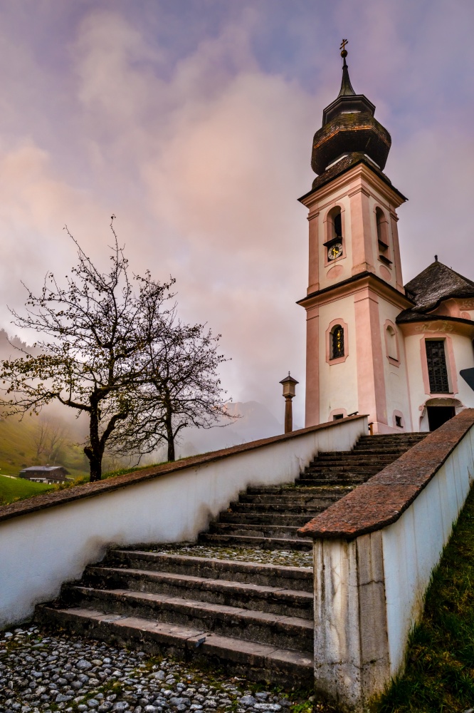 Overcast foggy autumn morning and the small famous Maria Gern pilgrimage church (built in the current form 1708 - 1710), Berchtesgaden, Bavaria, Germany