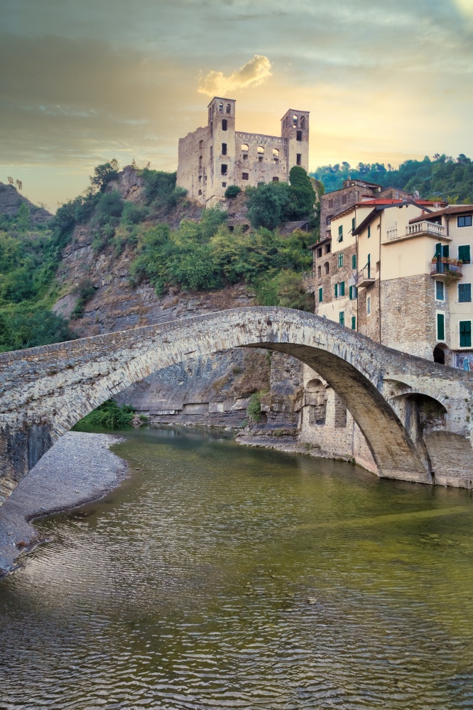 DOLCEACQUA, ITALY - CIRCA AUGUST 2020: Dolceacqua panorama with the ancient roman bridge made of stones and the castle