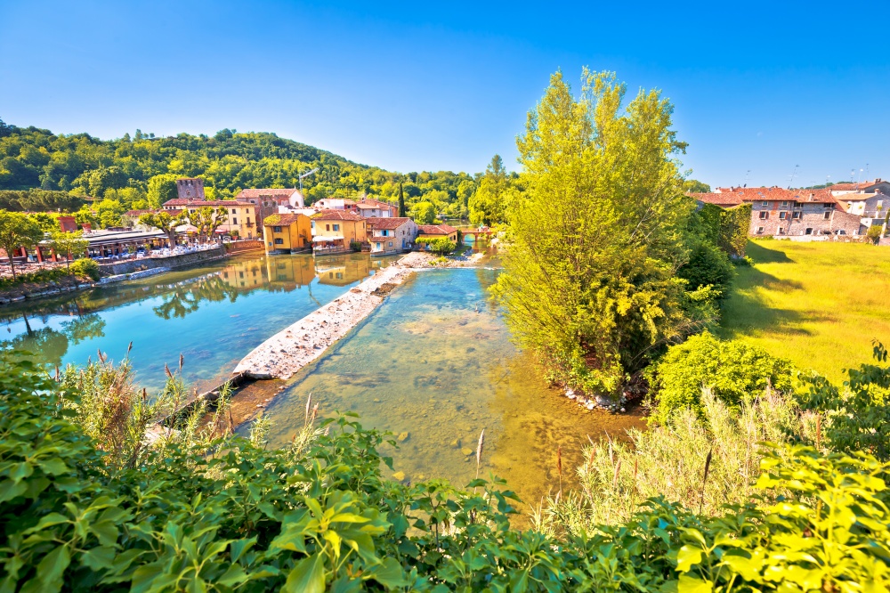 Mincio river green landscape and idyllic village of Borghetto view, Veneto region of northern Italy