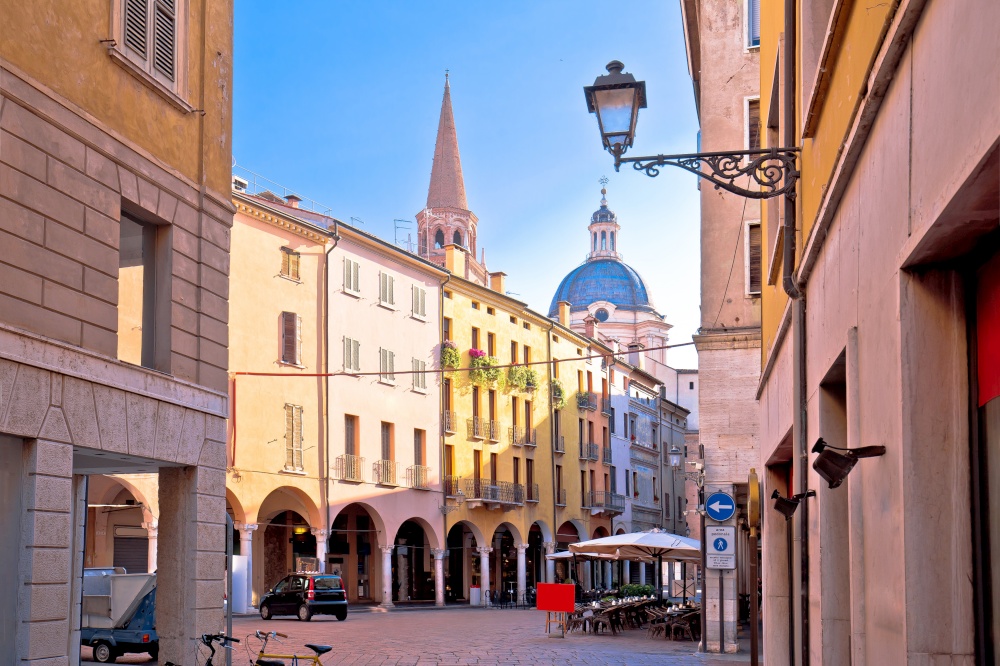 Mantova idyllic italian city street and church towers view, UNESCO world heritage site, Lombardy region of Italy