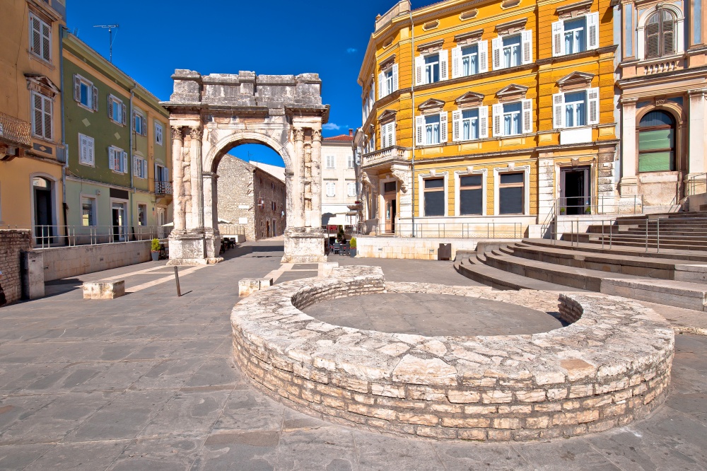 Square in Pula with historic Roman Golden gate street view, Istria region of Croatia