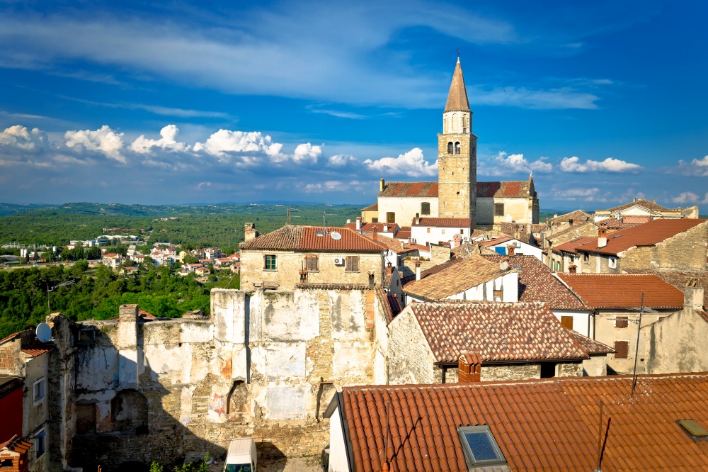 Old stone town of Buje tower and rooftops view, town in green landscape of Istria, Croatia