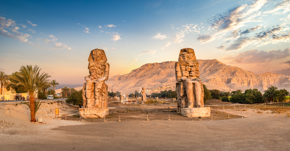 Egypt. Luxor. The Colossi of Memnon - two massive stone statues of Pharaoh Amenhotep