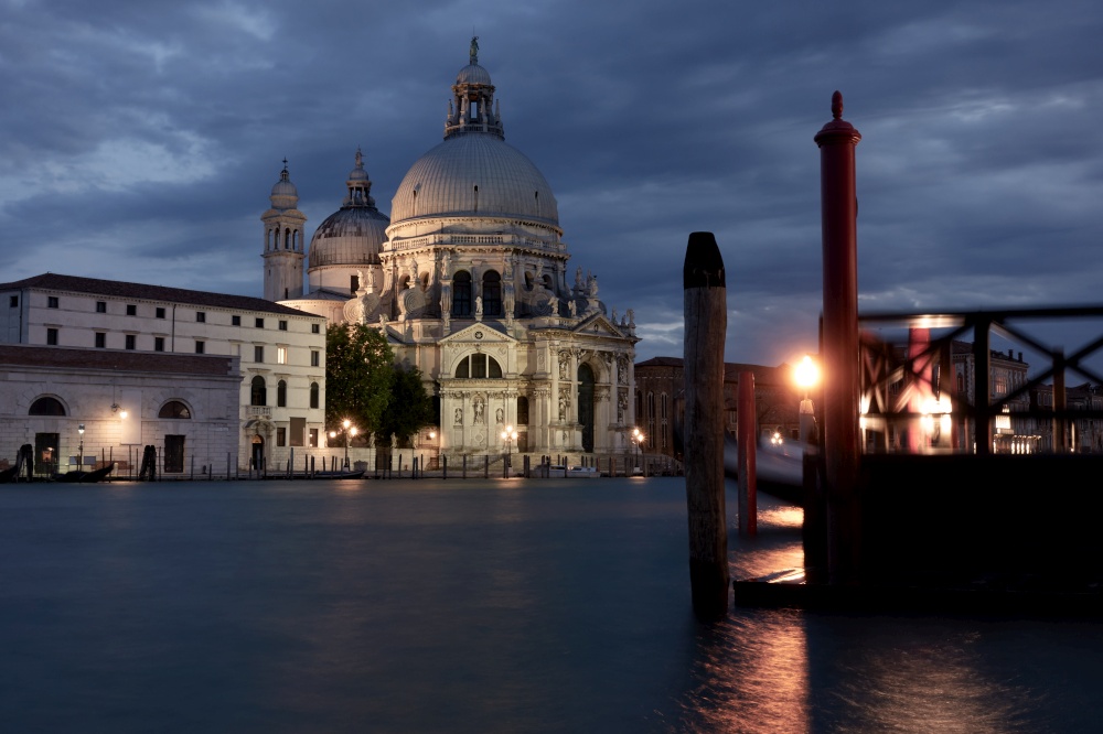 The Grand Canal and Santa Maria della Salute church in Venice at night, Italy. Venetian urban view