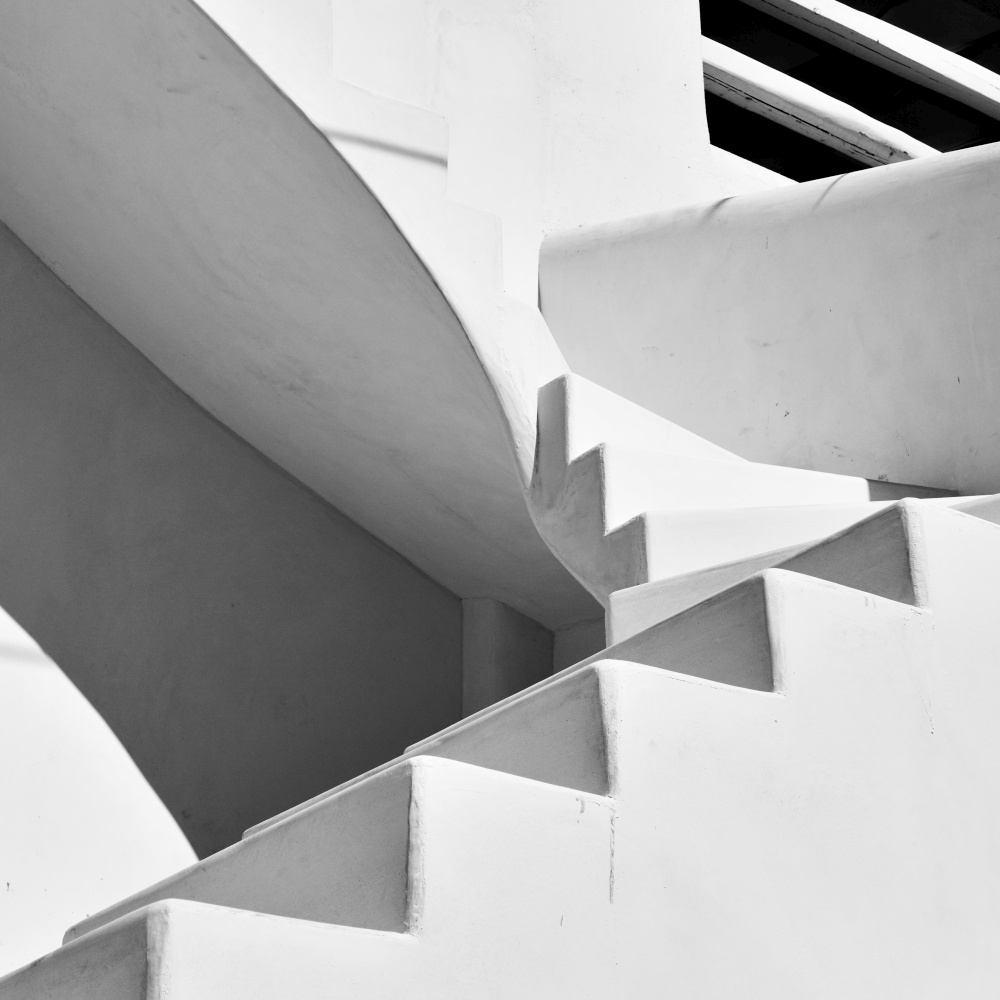 Outside staircase of traditional greek whitewashed house in Myconos Island, Greece. Black and white architectural photography